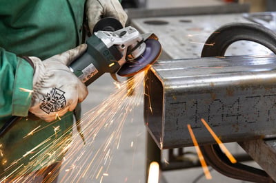 Ceramic grinding wheel beveling a steel tube