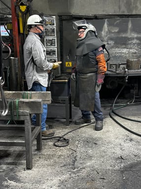 David Jescovitch, abrasives specialist manager with Weiler Abrasives, talks to an operator during a facility visit.  