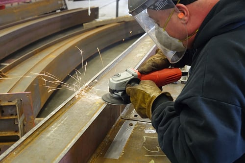 Metalynx 3D MAX ceramic resin fiber disc grinding a weld on a roller coaster steel beam